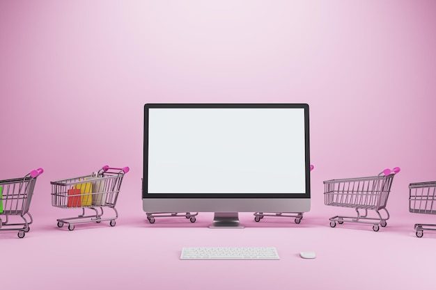 Concept de magasinage en ligne créatif avec chariots et écran d'ordinateur maquette blanc vide sur fond rose Boutique en ligne et concept de médias numériques Rendu 3D