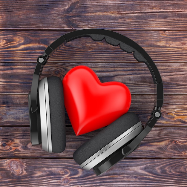 Concept De Musique D'amour. Casque Sans Fil Noir Et Coeur Rouge Sur Une Table En Bois. Rendu 3d