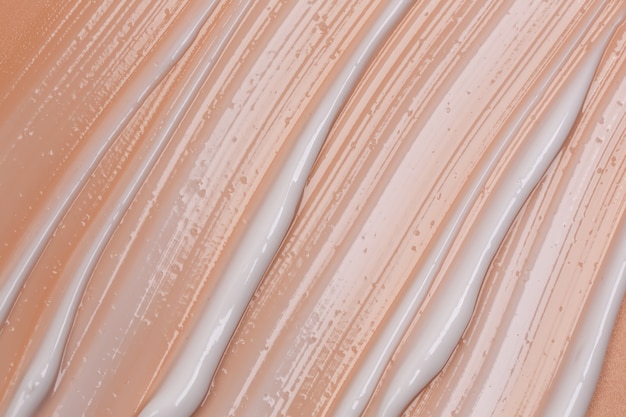 Concept pastel naturel cosmétique la texture de la crème liquide sur fond beige
