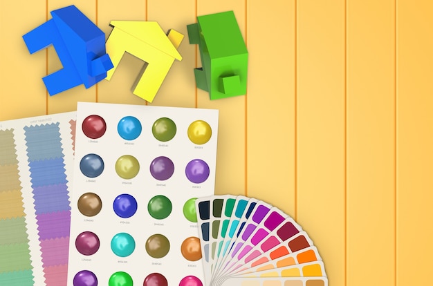 Concept de peinture à la maison avec des maisons colorées et un nuancier
