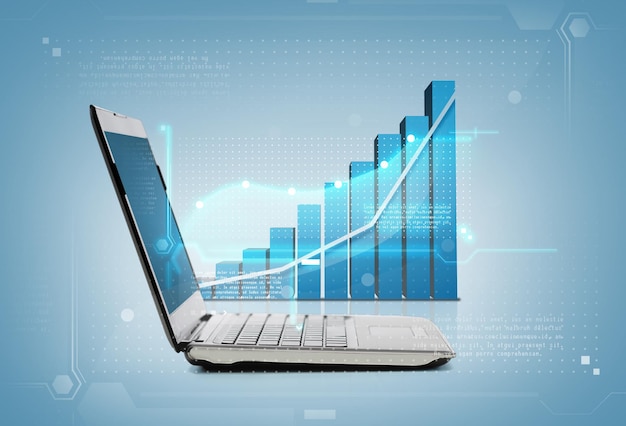 concept de technologie et d'économie - ordinateur portable avec graphique