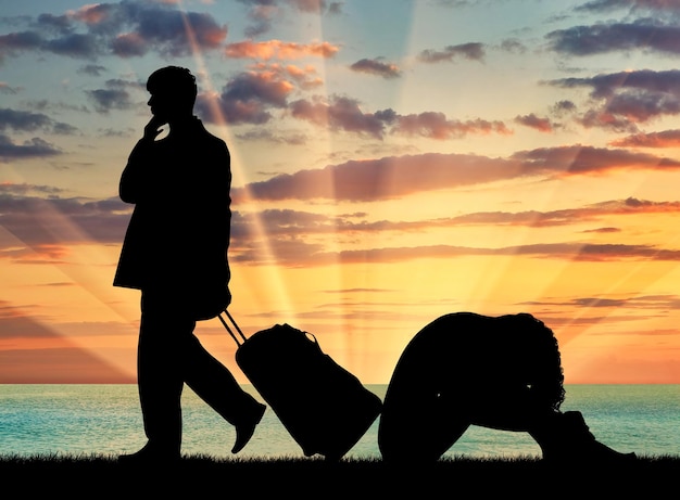 Photo concept de trahison et de trahison. la silhouette d'un homme laisse une femme au coucher du soleil