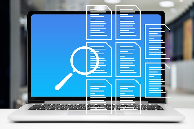 Photo le concept de vérification des documents graphiques avec des icônes de document sur fond d'ordinateur portable