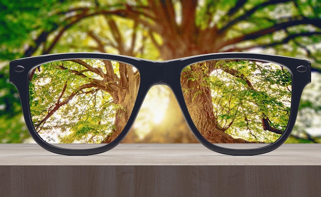 Concept de vision Lunettes sur table en bois rendu 3d