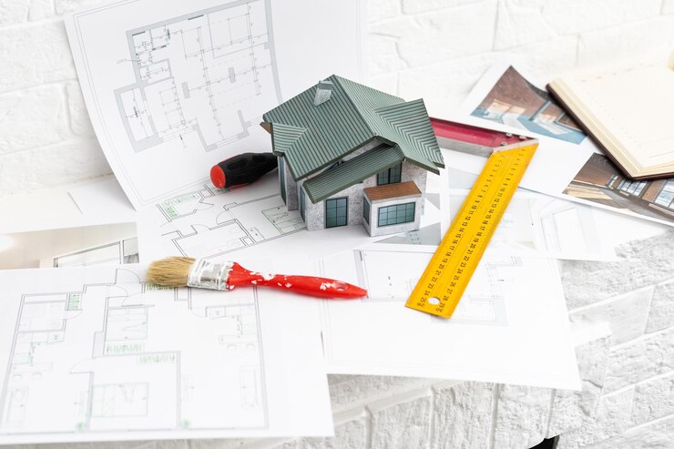construction de maison sur plans avec travailleur - projet de construction.