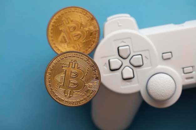 Contrôleur de jeu vidéo concept de jeu crypto avec une pièce de crypto-monnaie bitcoin