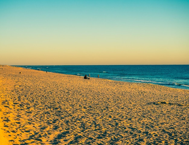 Coucher de soleil coloré sur la plage de Faros