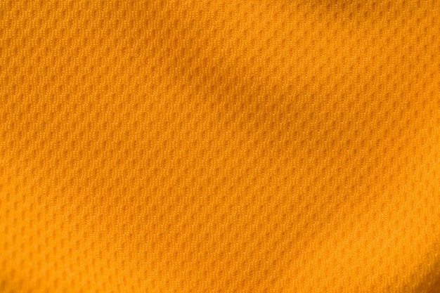 Couleur orange vêtements de sport tissu jersey football shirt texture vue de dessus