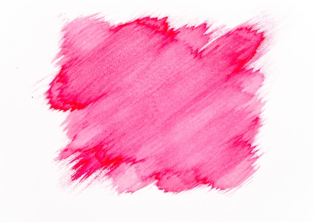 Coup de pinceau aquarelle rouge sur fond de papier blanc.