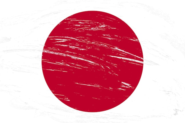 Photo coup de pinceau en détresse peint drapeau du japon sur fond blanc