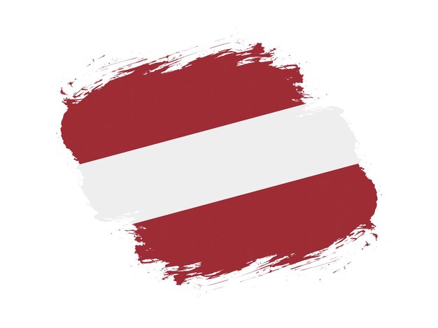 Coup de pinceau drapeau texturé de la Lettonie sur fond blanc