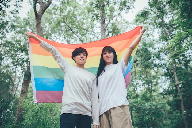 Couple de fille avec filleLGBT Pride month conceptAsian Handsome male make up and wear woman clothGay Freedom DayPortrait of Nonbinary on white background