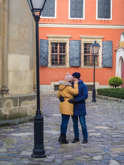 Couple hugging on lviv street