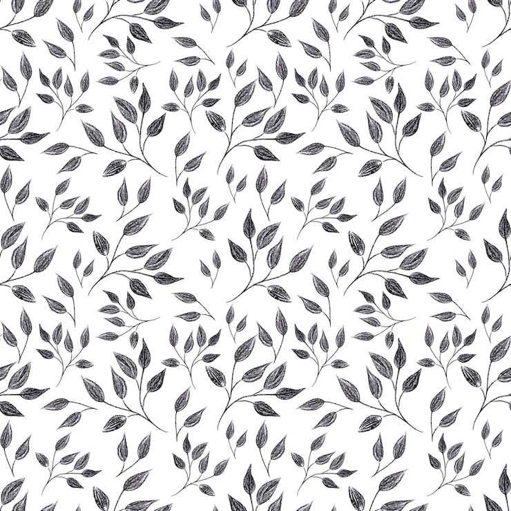 Photo crayon noir dessiné à la main laisse un motif sans couture isolé sur fond blanc peut être utilisé pour le tissu d'emballage textile