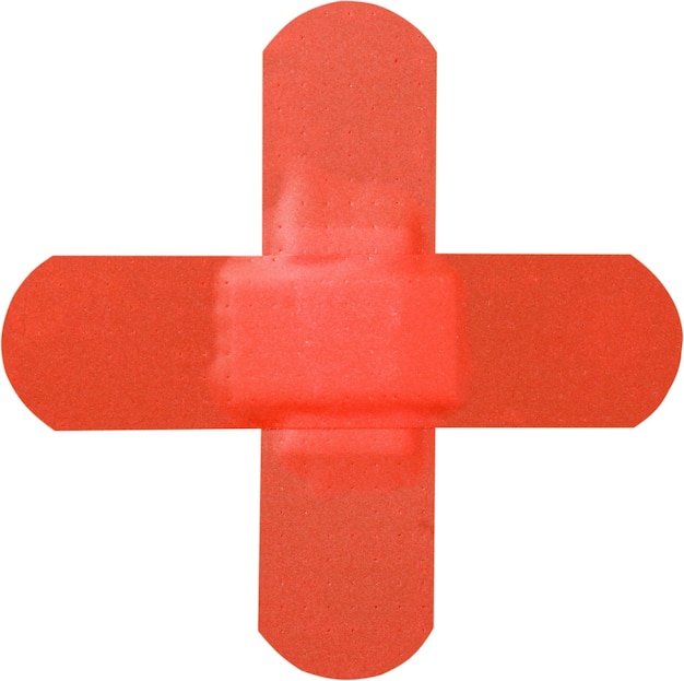 Croix de plâtre rouge isolé sur fond blanc