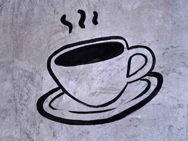 croquis d'icône de symbole de café sur le mur de ciment