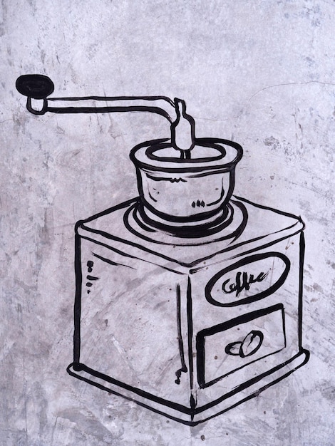 croquis d'icône de symbole de café sur le mur de ciment