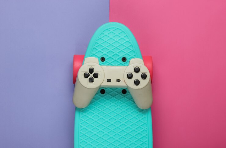 Photo cruiser board, gamepad sur papier de couleur