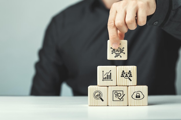 Cubes en bois assemblés sur le thème de l'application de l'intelligence artificielle en entreprise