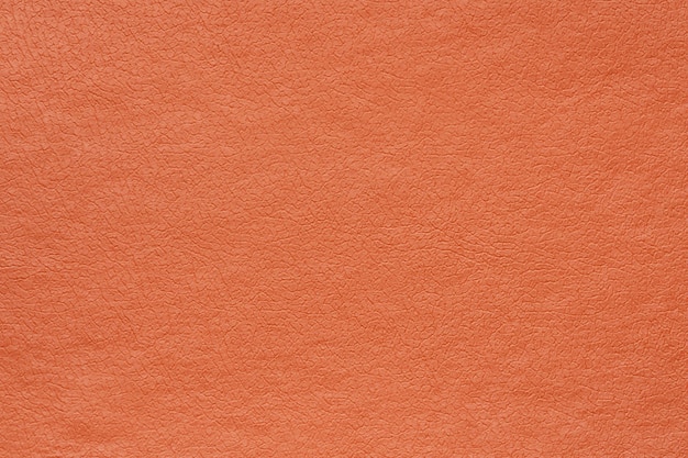 Cuir synthétique orange pour l'arrière-plan vue détaillée en gros plan du modèle de matériau de décoration de texture
