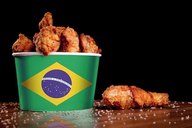 Cuisses de poulet BBQ dans un seau drapeau du Brésil