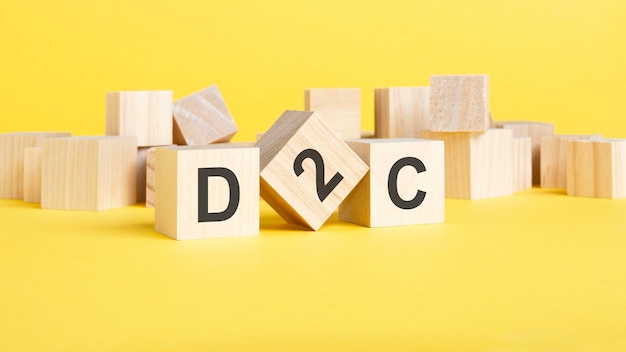 D2c Direct to Consumer symbole blocs de bois avec des mots