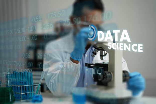 Data science Scientist working laboratory with microscope and test tubes analyzing data and conducting experiments emphasizing data science
