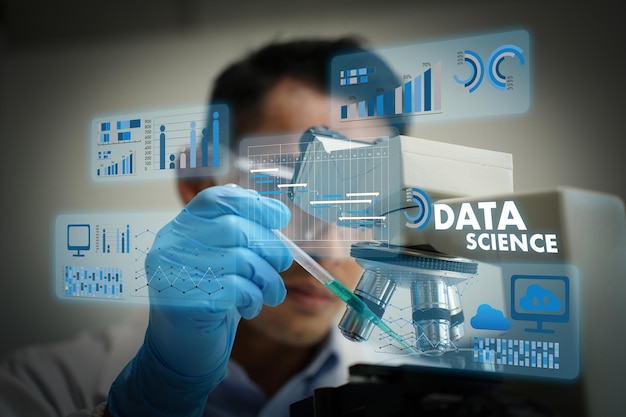 Data science scientist working with data analysis and research laboratory setting using microscope and digital data visualization conveying