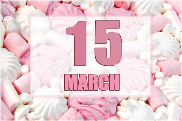 Date du calendrier sur fond de guimauves blanches et roses Le 15 mars est le quinzième jour du mois