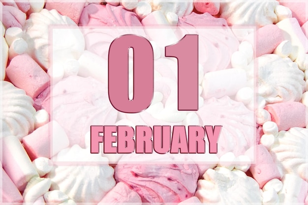 Date du calendrier sur fond de guimauves blanches et roses Le 1er février est le premier jour du mois