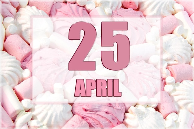 Date du calendrier sur fond de guimauves blanches et roses Le 25 avril est le vingt-cinquième jour du mois