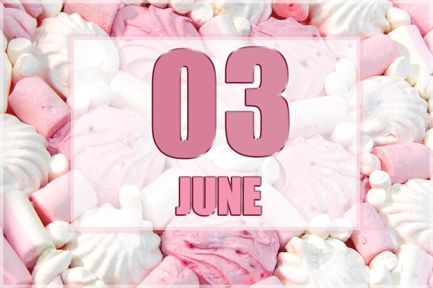 Date du calendrier sur fond de guimauves blanches et roses Le 3 juin est le troisième jour du mois
