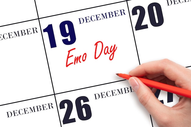 Photo décembre texte écrit à la main emo jour sur la date du calendrier enregistrer la date jour de vacances de l'année concept