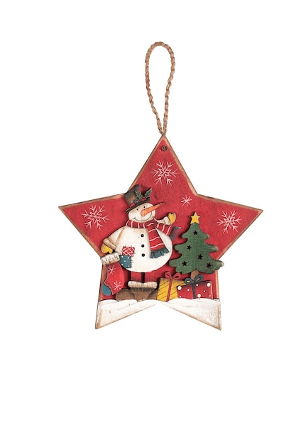 Une décoration de Noël en forme d'étoile rouge avec un bonhomme de neige et un arbre avec une étoile dessus.