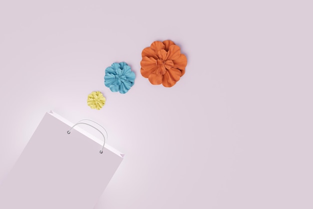 Décorations pour sacs cadeaux un sac cadeau à côté duquel se trouvent des fleurs en papier multicolores