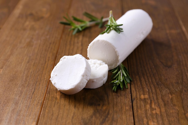 Photo délicieux fromage de brousse au romarin sur table en bois