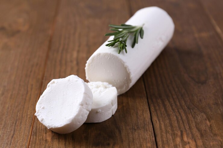 Photo délicieux fromage de brousse au romarin sur table en bois