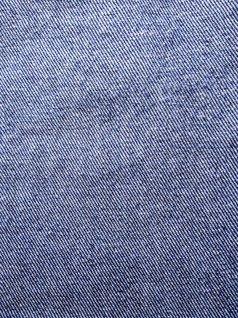 Photo denim texture et détail de blue jeans closeup fond texturé