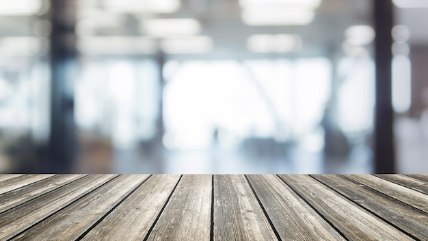 Photo dessus de table en bois et arrière-plan de l'espace intérieur de bureau bokeh floue