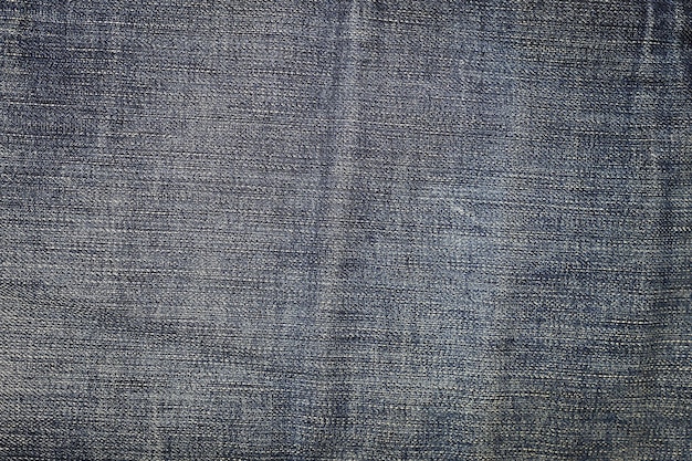 Détail agrandi de fond de texture de jeans en denim bleu