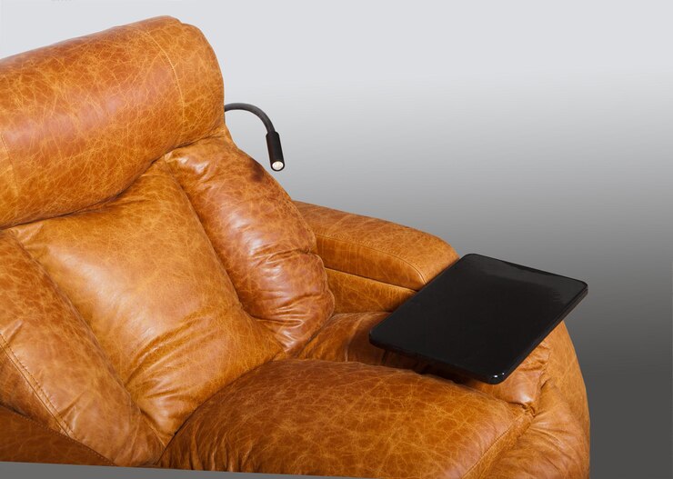 Photo détail d'un fauteuil en cuir moderne avec support et lampe
