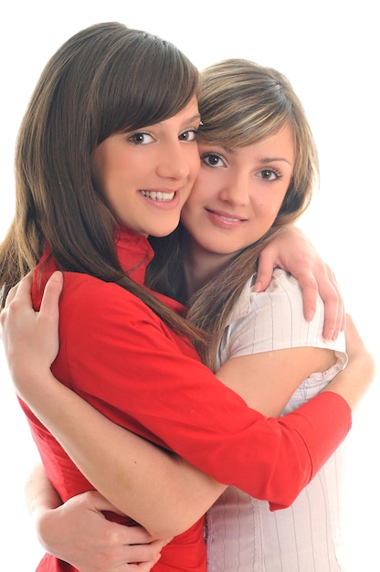 deux jeunes filles amies lesbiennes isolées heureuses sur un fond blanc