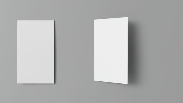 Deux morceaux de papier blancs sont placés sur un fond gris.