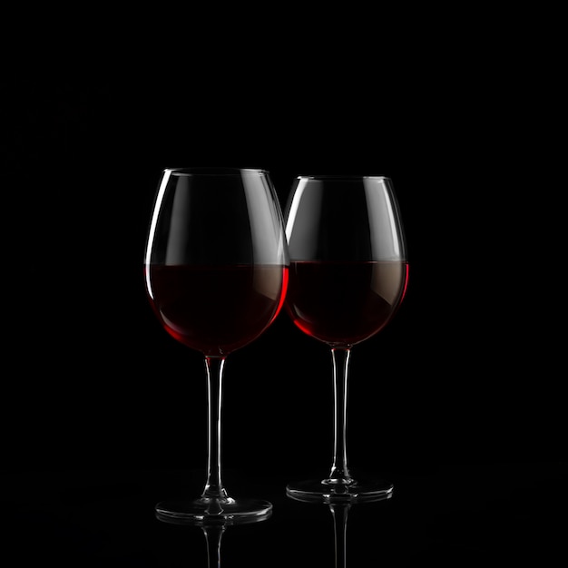 Deux verres à vin rouges dans l'obscurité