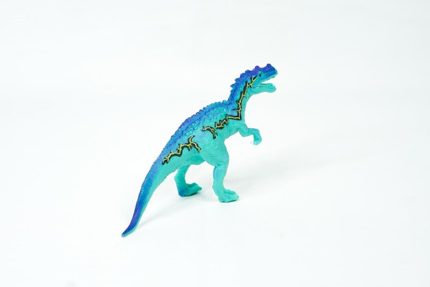 Dinosaure. Jouet En Caoutchouc Plastique Isolé Sur Blanc.