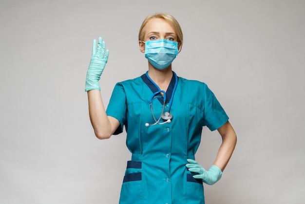 Docteur en médecine infirmière femme portant un masque de protection et des gants en latex - comptage