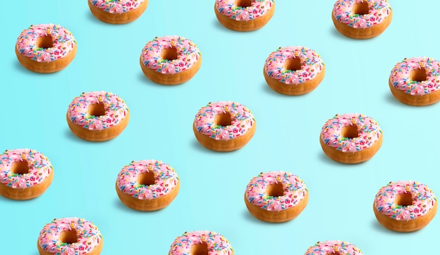 Donuts décorés d'étincelles colorées. motifs sur fond bleu