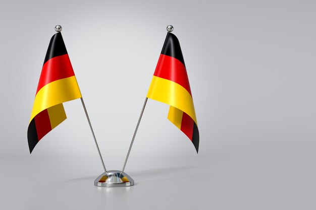 Double drapeau de table de la République fédérale d'Allemagne sur fond gris Rendering 3D