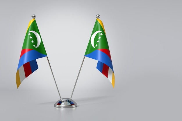 Photo double drapeau de l'union des comores sur fond gris rendering en 3d