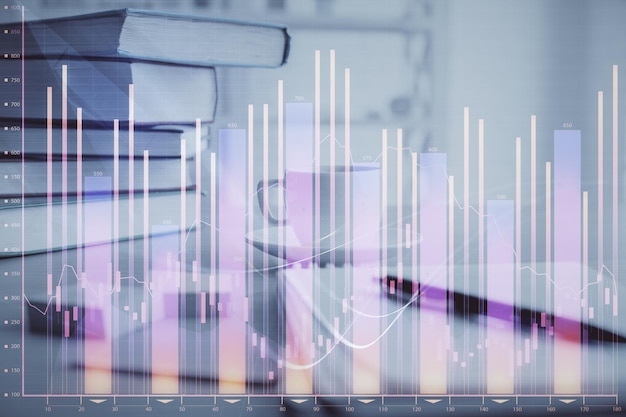 Double exposition du graphique financier et du bureau avec du café et des objets sur le fond de la table Concept de négociation sur le marché des changes